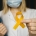 Doctor holding a yellow ribbon