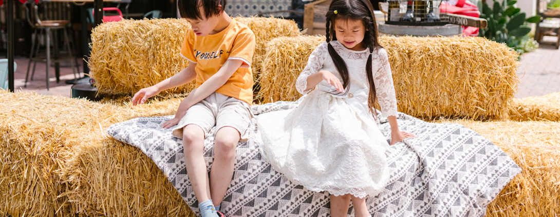 autistic children sitting on the hay