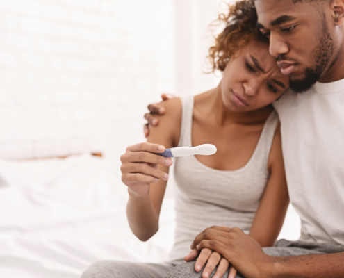 couple feeling sad about infertility