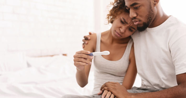 couple feeling sad about infertility
